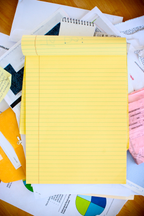 yellow notepad and papers