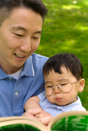 Father reading to baby