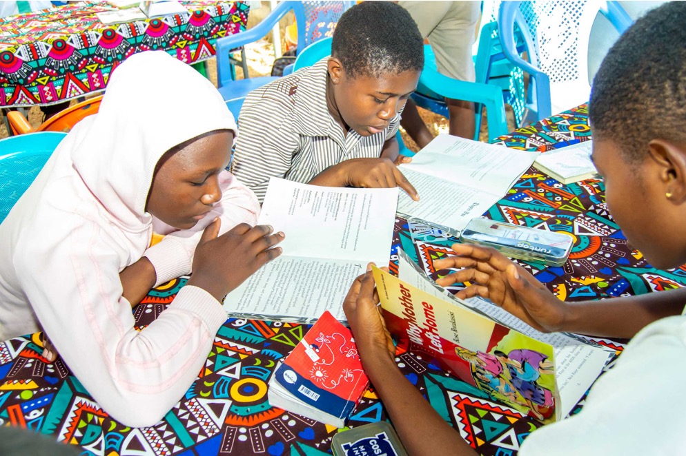 Photo of children reading in a library created by Learners Girls Foundation in Ghana.